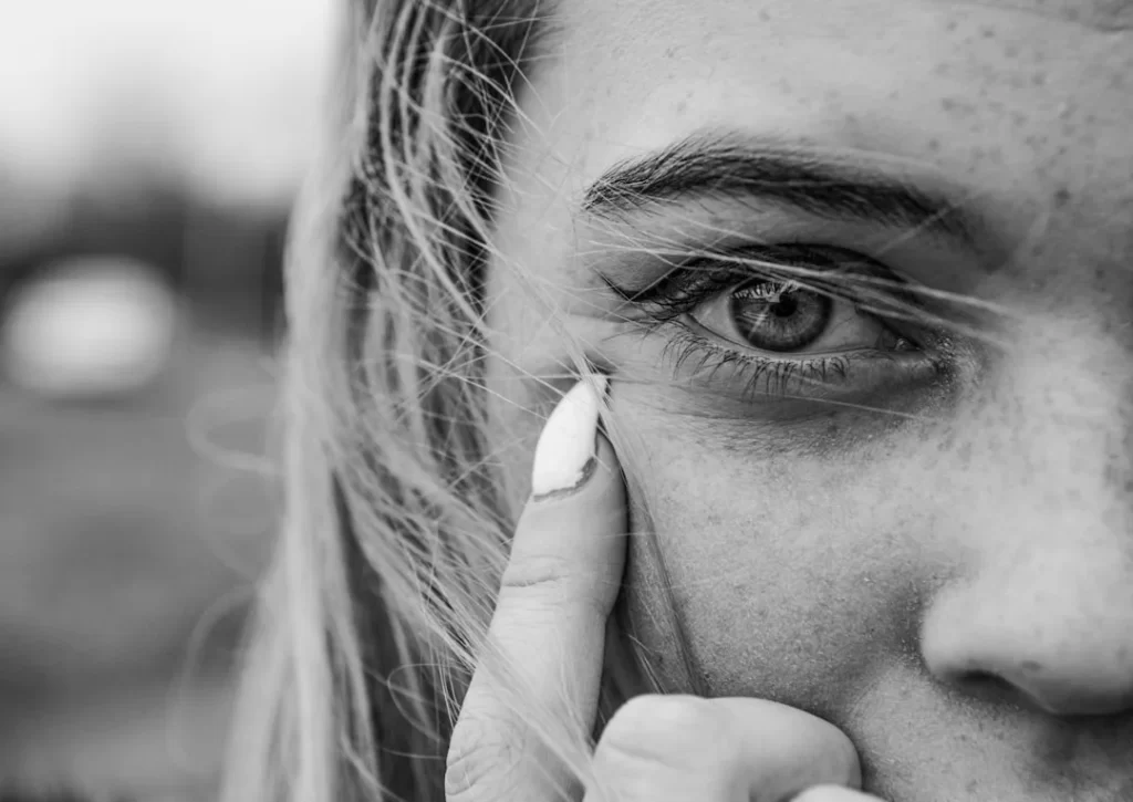 grayscale photo of womans face