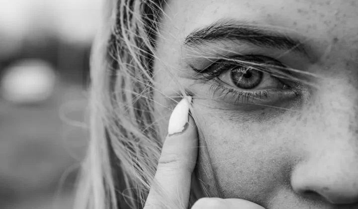 grayscale photo of womans face