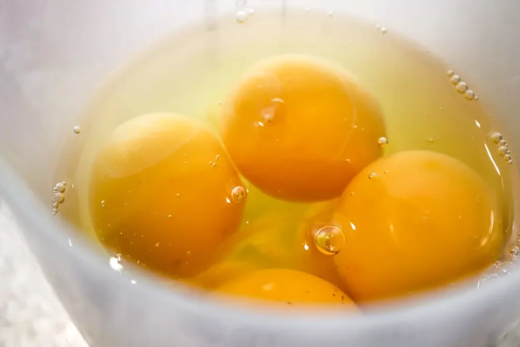yellow liquid in white ceramic cup
