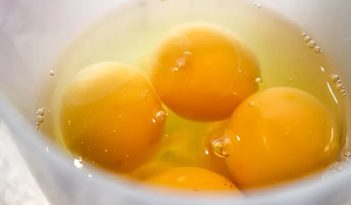 yellow liquid in white ceramic cup