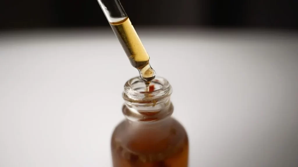 a bottle filled with liquid and a pipe sticking out of it