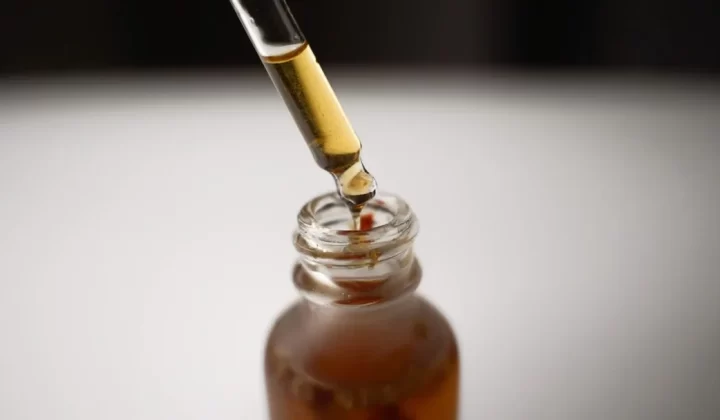 a bottle filled with liquid and a pipe sticking out of it