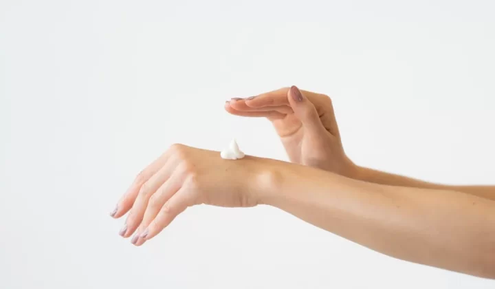 a close-up of hands holding a ball