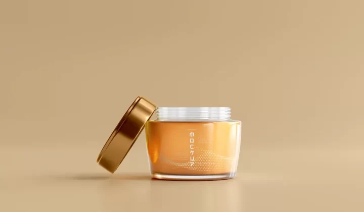 a jar of honey with a gold lid