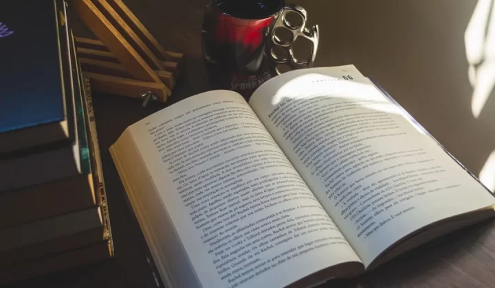 white book page on brown wooden table