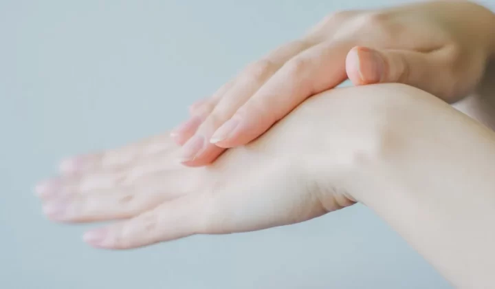 persons hand holding babys hand