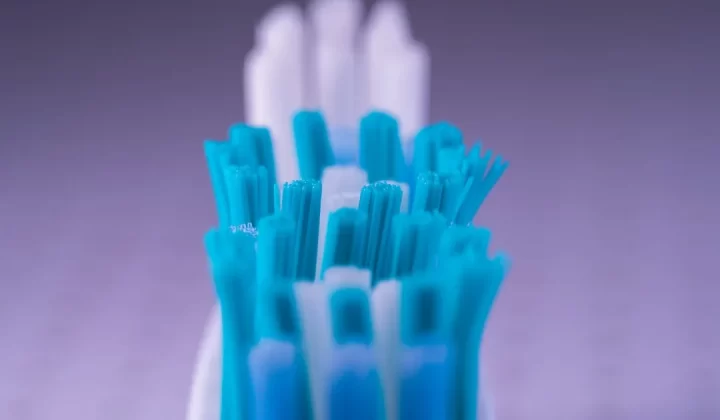 Close-up view of a toothbrush head and bristles.