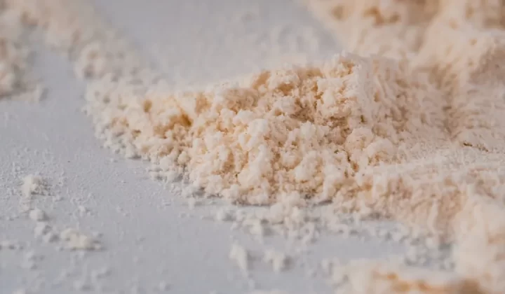 a pile of powdered sugar on a white surface