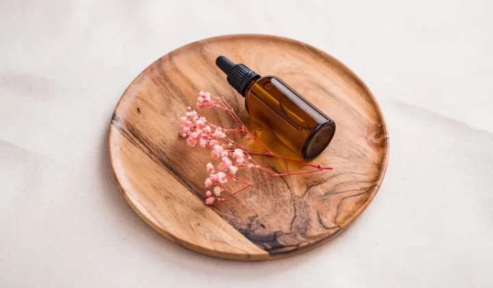 a bottle of alcohol on a wooden board