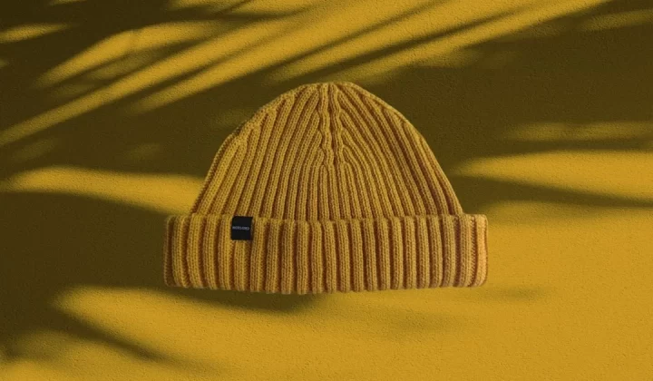 white knit cap on yellow textile