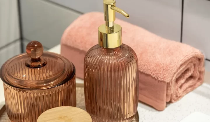a bathroom sink with a soap dispenser and a soap dish