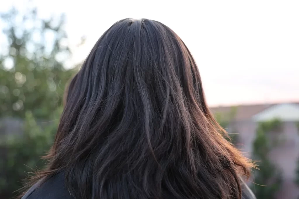 a close up of a person with long hair