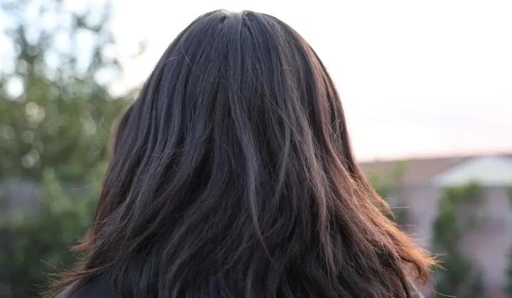 a close up of a person with long hair