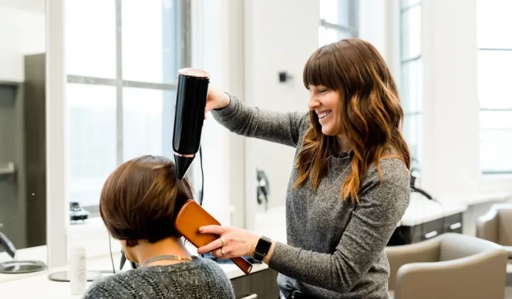 woman holding hair dryer