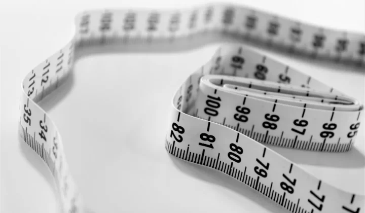 selective focus photography of tape measure
