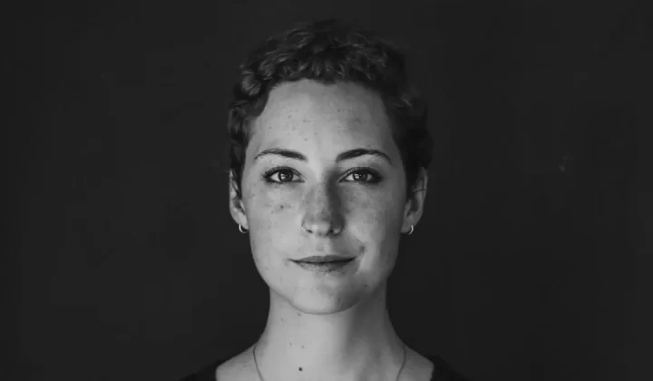 grayscale photo of woman wearing necklace and top