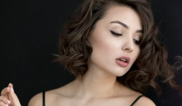 woman on front of black background