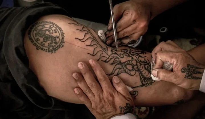 person with tattoo on right hand