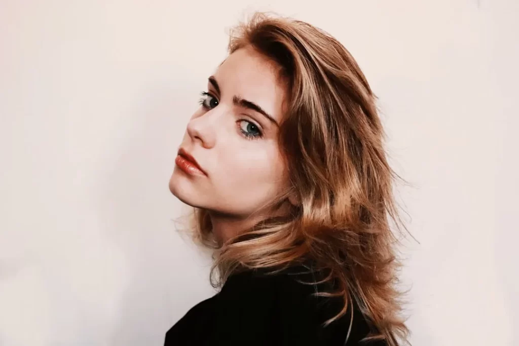 a close up of a person with long hair