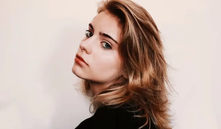 a close up of a person with long hair
