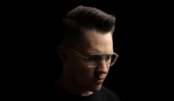 man in black crew neck shirt wearing black framed eyeglasses