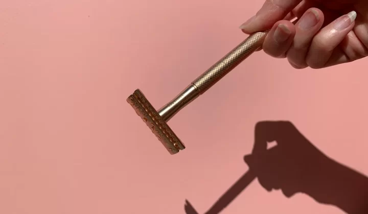 person holding gray metal tool