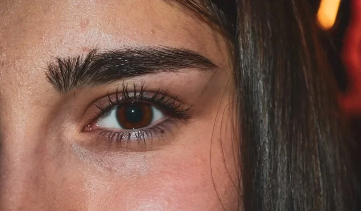 woman with black hair and blue eyes