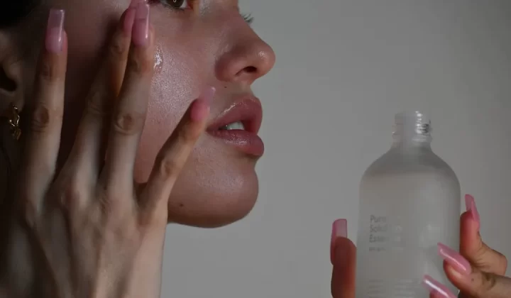 a person holding a bottle