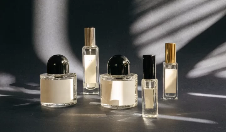 A group of perfume bottles sitting on top of a table