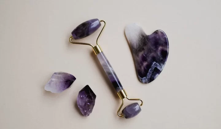 a pair of scissors and some amethysts on a table