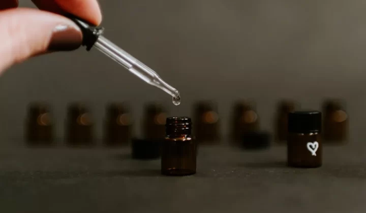 selective focus photography of brown tinted glass bottle