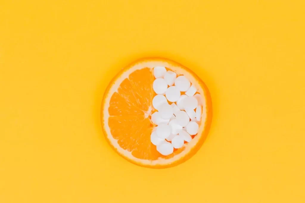 orange fruit slices on yellow surface