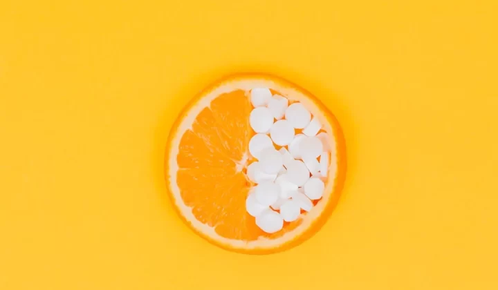 orange fruit slices on yellow surface
