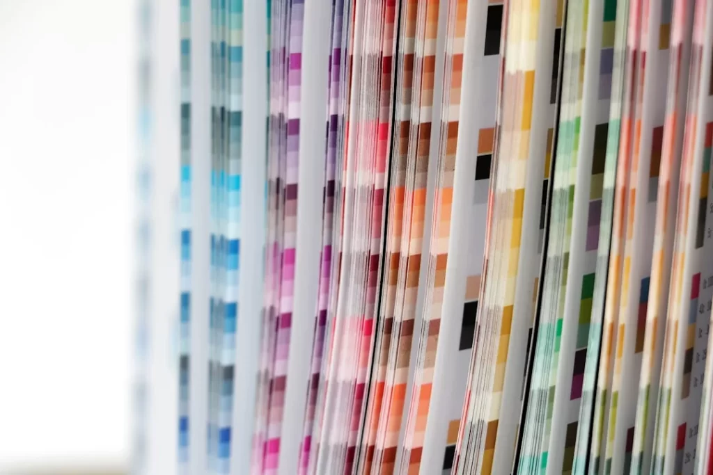 a close up of a number of different colored papers