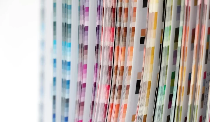 a close up of a number of different colored papers