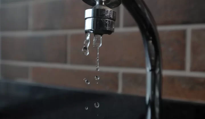 a faucet with water running from it's spout