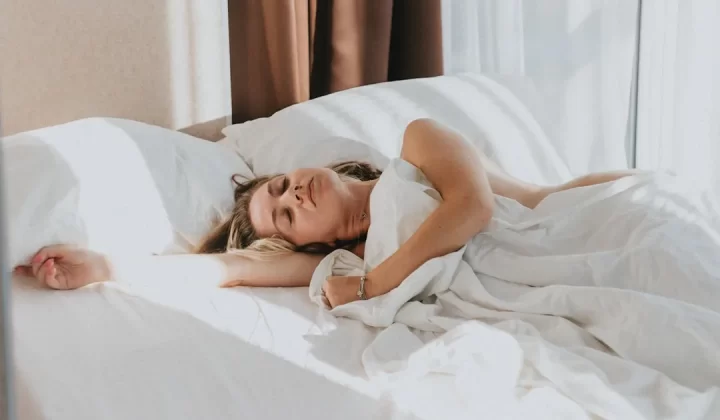 a person lying in a bed