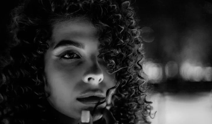 a woman with curly hair
