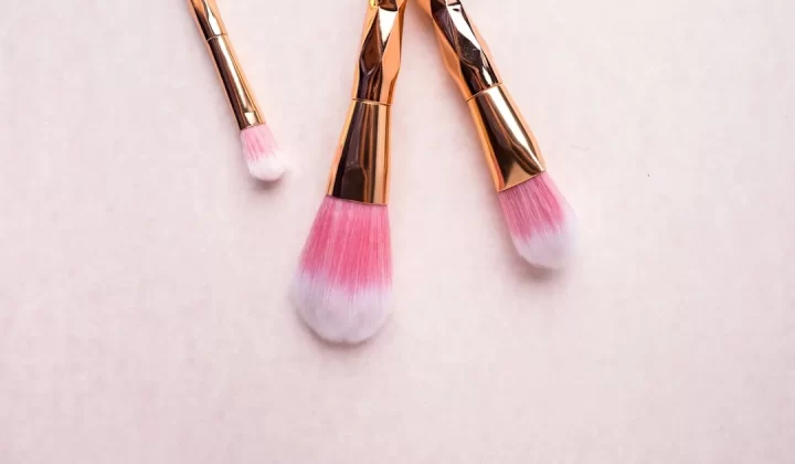 gold-colored makeup brushes